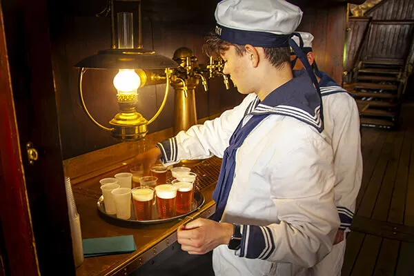 Crew member getting beverages ready